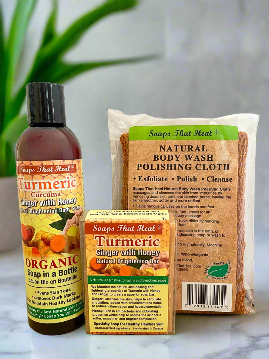 Collection of 'Soaps That Heal' products including a bottle, box, and cloth on a marble surface with a plant in the background.