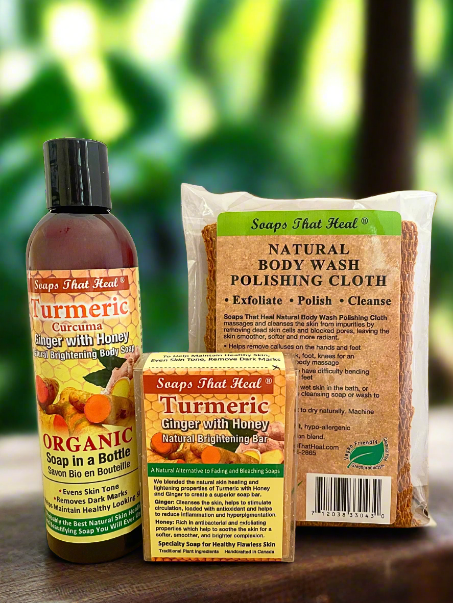 Collection of natural skincare products including a bottle, box, and cloth with 'Soaps That Heal' branding on a blurred green background.