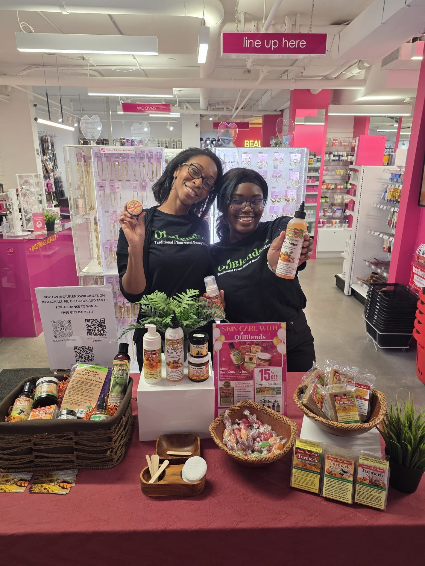 Beautiful product table display featuring the full OilBlends collection at the Clore Beauty Supply event, showcasing our plant-based toner, rich body butter, specialty soaps, premium oils, and natural skin-correction products arranged for attendees to explore.