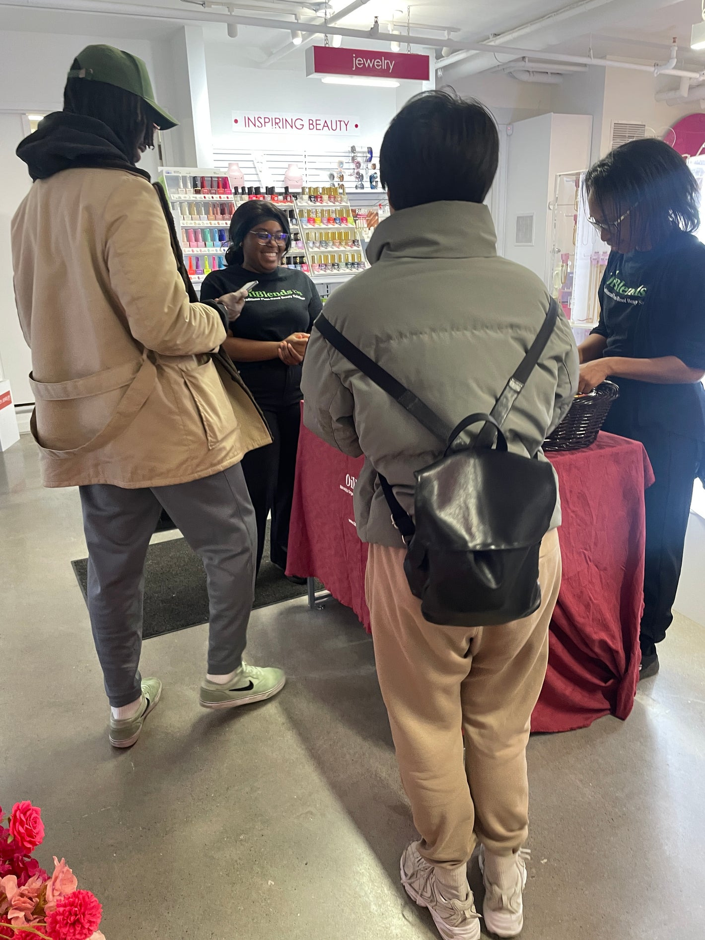 Attendees exploring OilBlends traditional plant-based beauty products at the Clore Beauty Supply event, engaging with natural skincare displays and testing premium oils and soaps. Uncle Benney's, Soaps That Heal, all organic ingredients for healthy skin 
