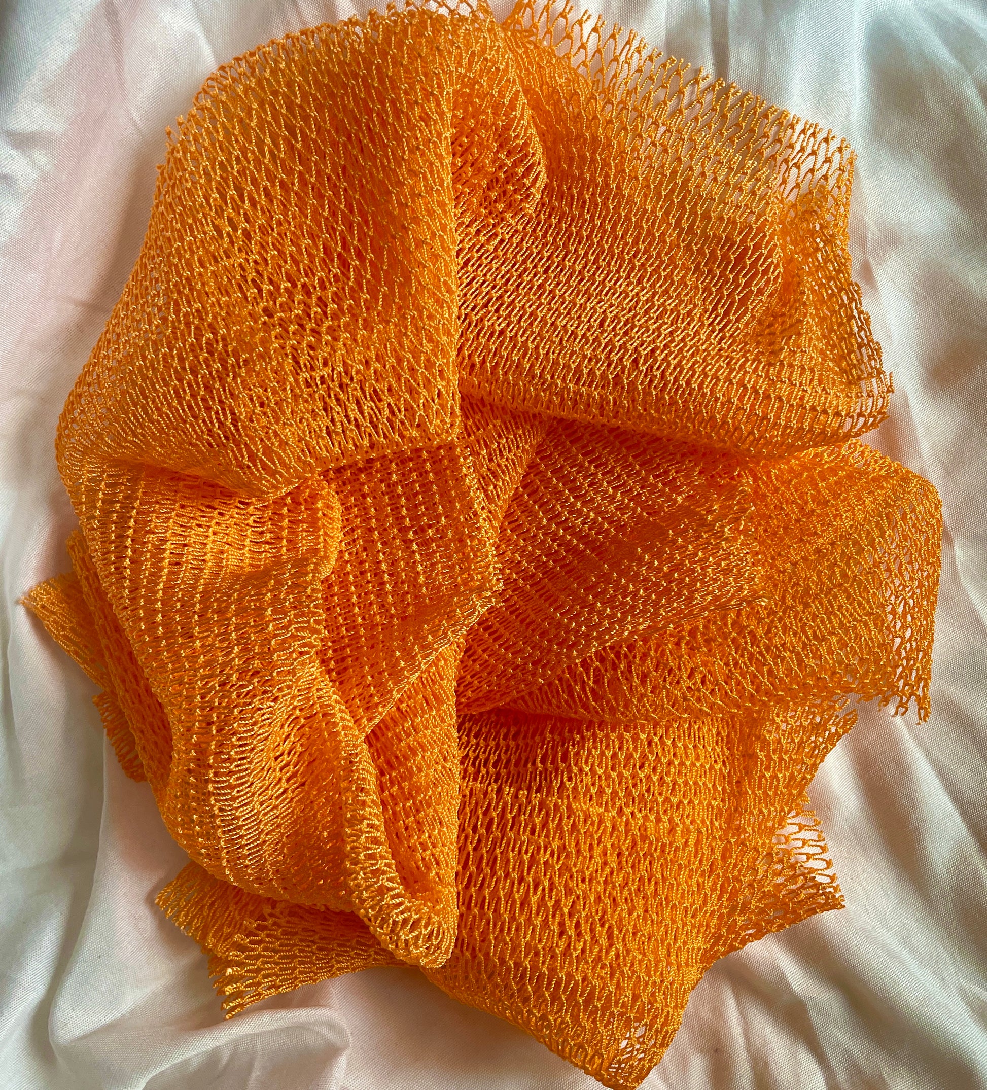 the best african net sponge for softer smoother skin, orange colour wash cloth