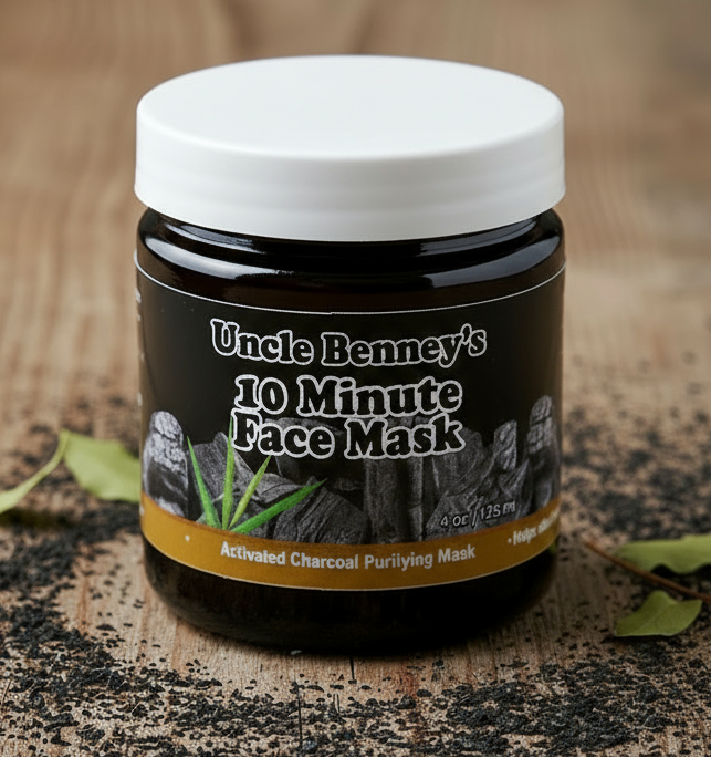 Jar of Uncle Benney's 10 Minute Face Mask on a wooden surface with activated charcoal powder.  Use charcoal powder to draw out impurities, excess oil, and dirt from deep within pores, which can help prevent breakouts in in Canada, USA, UK, and Caribbean, Toronto, France, Europe, Montreal, Ottawa, Edmonton, New York, London, Vancouver, 