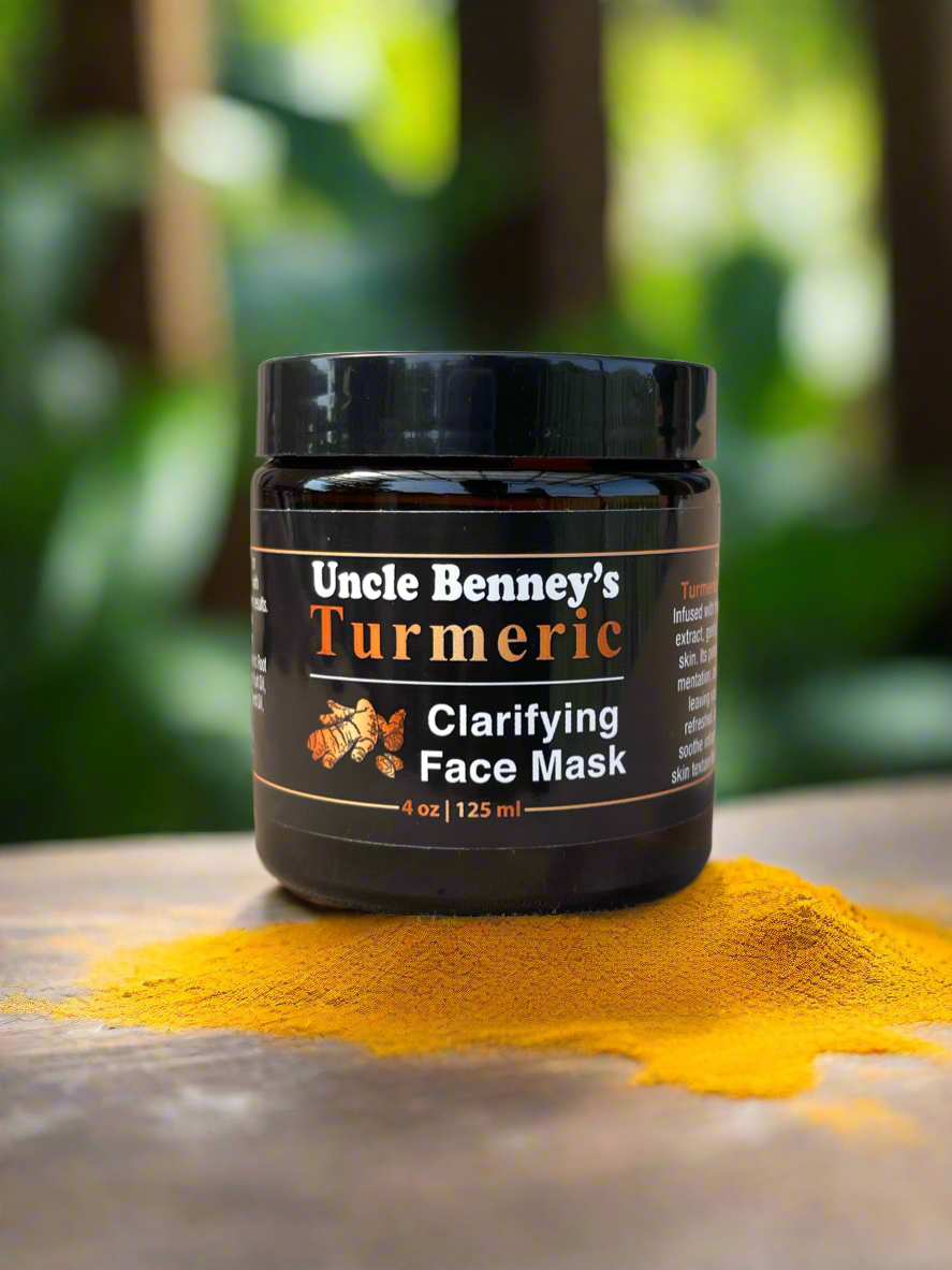 Jar of Uncle Benney's Turmeric Clarifying Face Mask with turmeric powder on a wooden surface, organic skincare products in canada, Infused with the power of organic turmeric root extract, our New Uncle Benney's Turmeric Clarifying Face Mask gently detoxifies and rejuvenates your skin. Turmeric's potent antioxidants target: Hyperpigmentation, Dark Spots, uneven Skin Tone. 
